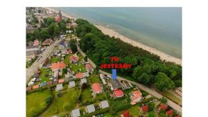 an aerial view of a town with a sign that reads v history at Noclegi u Kostka Sarbinowo in Sarbinowo
