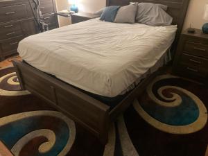 a bed in a bedroom with carpeted floors at Dayton get away in Dayton