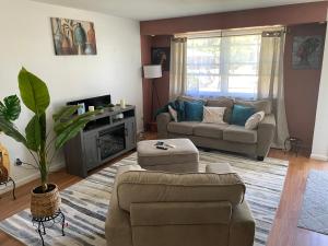 a living room with a couch and a fireplace at Dayton get away in Dayton