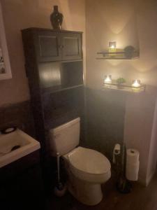 a bathroom with a white toilet and a sink at Dayton get away in Dayton