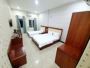Postel nebo postele na pokoji v ubytování Bảo Trân Hotel Pleyku - by BAY LUXURY + 5 fotografií