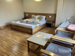 Postel nebo postele na pokoji v ubytování Sakura Garden Retreat, Ravangla
