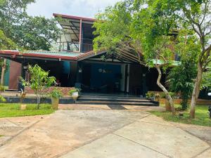 a house with the front entrance of it at New Runaliya in Anuradhapura