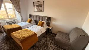 Voodi või voodid majutusasutuse Hotel Tynec toas