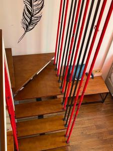 a set of stairs with red and white poles at April Fair Duplex Apartment Guagnzhou South Railway Station Min Jie Branch in Guangzhou