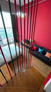 a room with a bed and a couch in a room at April Fair Duplex Apartment Guagnzhou South Railway Station Min Jie Branch in Guangzhou