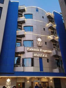 a hotel with a sign that reads patients express hotel at Falettis Express Islamabad in Islamabad