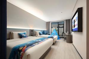 Voodi või voodid majutusasutuse Atour Light Hotel Qingdao North Station Shengping Road toas