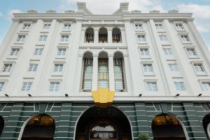 a large white building with a large window at Kindness Hotel - Taitung Branch in Taitung City