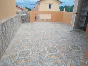 a mosaic tile floor on a balcony of a house at Lovely house in Pagadian city in Norte
