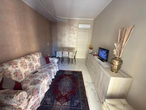 a living room with a couch and a tv at Casa Mare in Rapallo