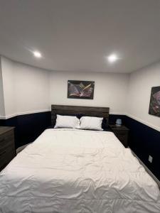 a bedroom with a large white bed in it at Aurora Nights in Fairbanks