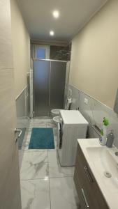 a bathroom with a shower and a toilet and a sink at Casa Mare in Rapallo +10 photos