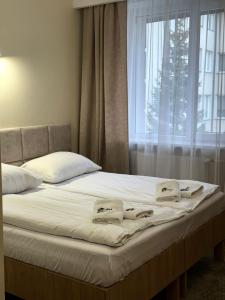 Posteľ alebo postele v izbe v ubytovaní Hotel TM