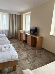 Posteľ alebo postele v izbe v ubytovaní Hotel TM