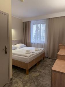 Posteľ alebo postele v izbe v ubytovaní Hotel TM