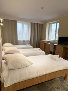 Posteľ alebo postele v izbe v ubytovaní Hotel TM