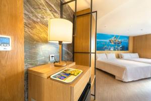 Voodi või voodid majutusasutuse Kenting Long Beach Hotel toas
