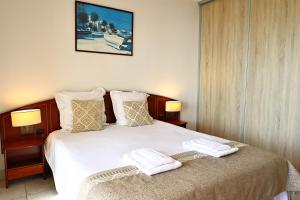 Postel nebo postele na pokoji v ubytování Évasion Corse - T2 Vue Mer, Piscine & Plage