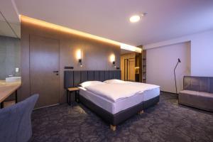 Postel nebo postele na pokoji v ubytování Harmony Club Hotel