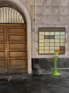 a sign on the side of a building next to a door at Milion's house in Salerno +2 photos