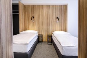 Postel nebo postele na pokoji v ubytování Harmony Club Hotel