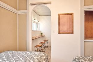 Ένα ή περισσότερα κρεβάτια σε δωμάτιο στο 和氣会々野方 Wakiaiai Nogata