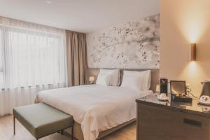 Voodi või voodid majutusasutuse Hotel DAS SAAL toas