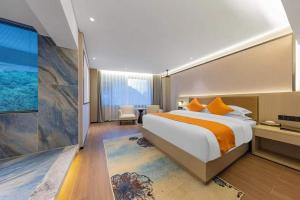 a hotel room with a bed and a large window at 天门山云尚景豪酒店 in Zhangjiajie
