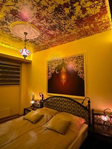 a bedroom with two beds and a painting on the ceiling at APARTMENTS VRANAS in Visoko +41 photos