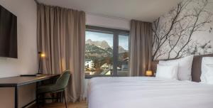 Voodi või voodid majutusasutuse Hotel DAS SAAL toas
