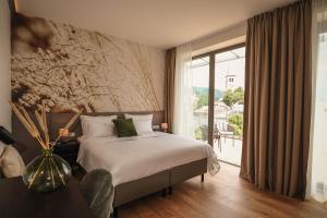 Voodi või voodid majutusasutuse Hotel DAS SAAL toas