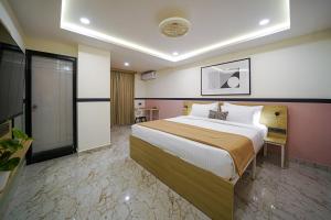 Ένα ή περισσότερα κρεβάτια σε δωμάτιο στο Olive Zip Sanjay Nagar by Embassy Group