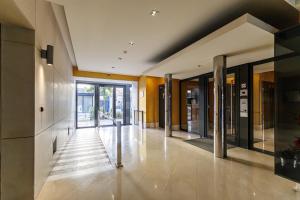 a hallway of a building with glass doors at Nice Luxury in Nice