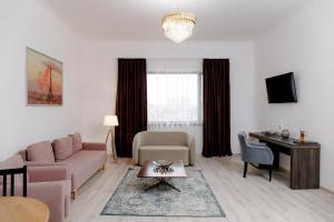 TV a/nebo společenská místnost v ubytování INFINITY PLAZA BLOCK 1