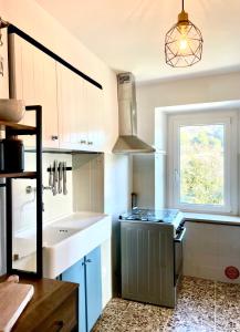 Kuchyň nebo kuchyňský kout v ubytování Microfattoria Lenta