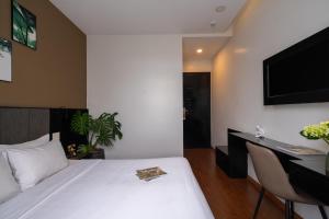 TV a/nebo společenská místnost v ubytování Hotel Nature Garden Da Lat