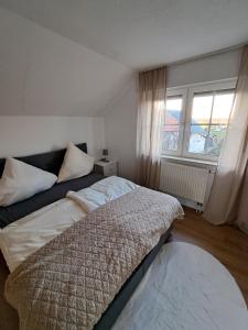 Ένα ή περισσότερα κρεβάτια σε δωμάτιο στο Ferienhaus Feldharmonie