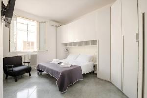 Postel nebo postele na pokoji v ubytování KuMmìe - Casa Vacanze