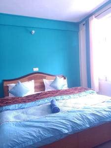 A bed or beds in a room at Check-in & Chill