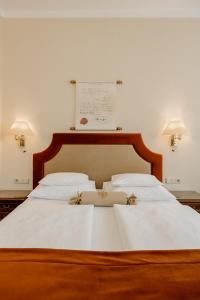 Postel nebo postele na pokoji v ubytování Hotel Erzherzog Rainer