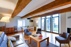 a living room with a couch and a table at Manoir de Larmor in Vannes