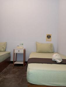 Postel nebo postele na pokoji v ubytování Ijen & Sleep Homestay