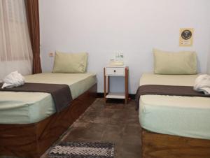 Postel nebo postele na pokoji v ubytování Ijen & Sleep Homestay