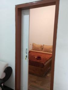 Postel nebo postele na pokoji v ubytování Ijen & Sleep Homestay