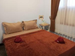Postel nebo postele na pokoji v ubytování Ijen & Sleep Homestay