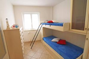 a room with two bunk beds and a ladder at Casa Martina in Otranto in Otranto