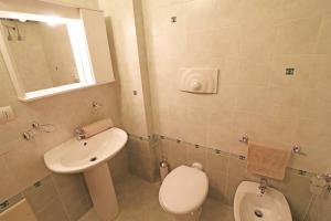 a bathroom with a toilet and a sink at Casa Martina in Otranto in Otranto