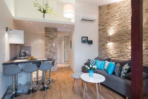 a kitchen and living room with a couch and a table at Neo Apartments in Krakow