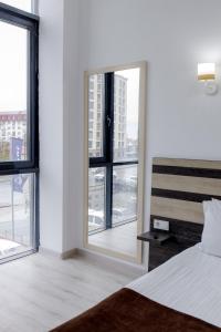 Postel nebo postele na pokoji v ubytování INFINITY PLAZA BLOCK 1